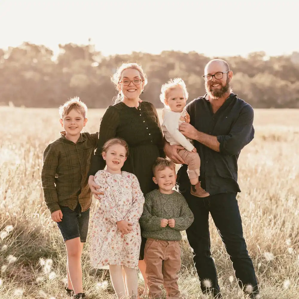 Family portrait in a field.