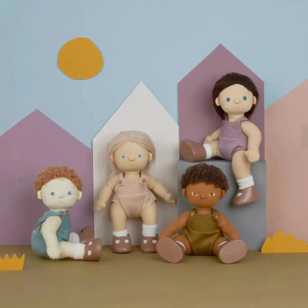 Four cloth dolls with painted features.