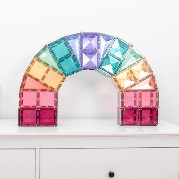 Pastel magnetic tiles made into a rainbow